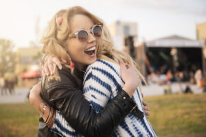 young blonde egg donor hugging another egg donor before an egg donor IVF cycle